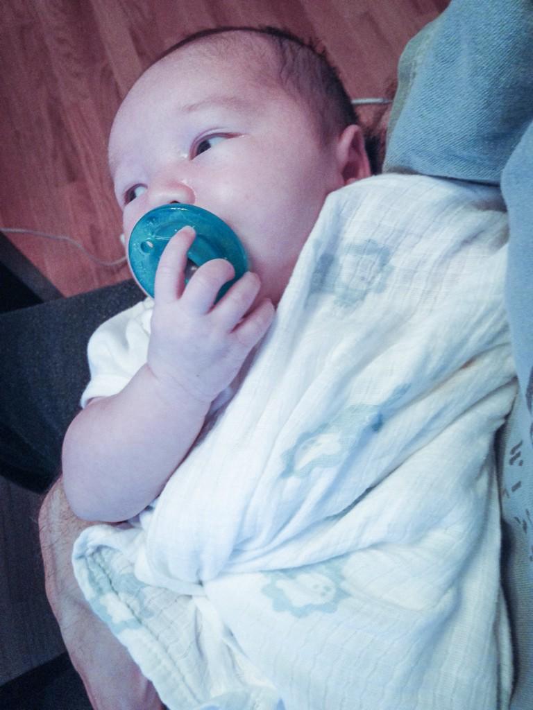 holding baby Emmett, designing one-handed